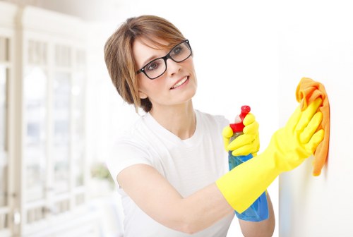 Professional cleaning an Airbnb living room for guest turnover
