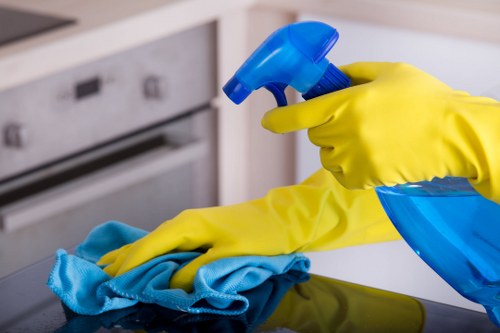 Kitchen surfaces being cleaned during domestic cleaning