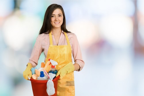 Professional cleaner maintaining shared hallway area