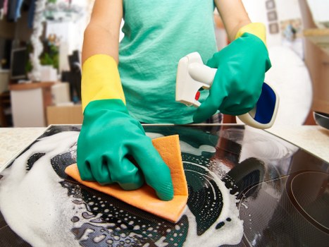 Spot cleaning a mattress stain with a cloth and cleaning solution